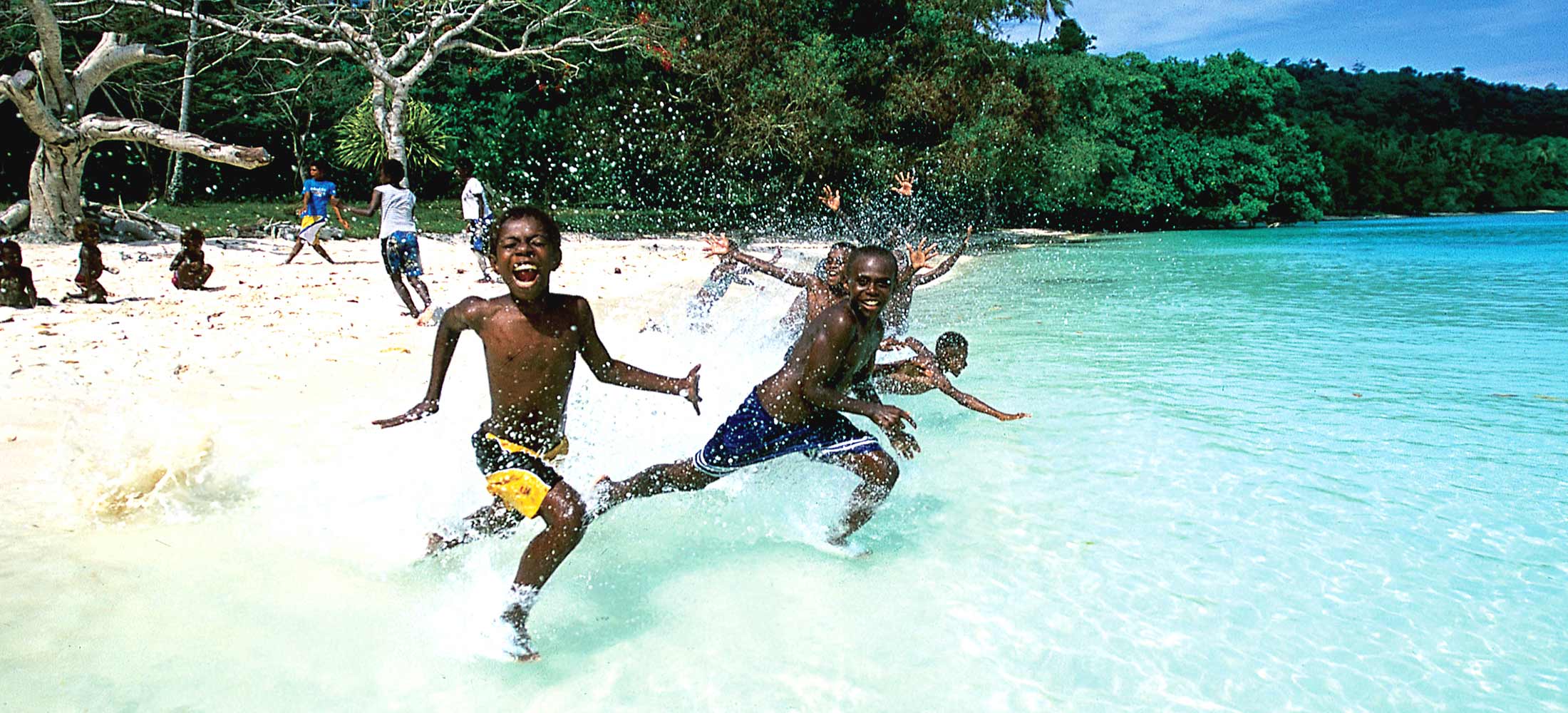 South Pacific tours Vanuatu - children running water